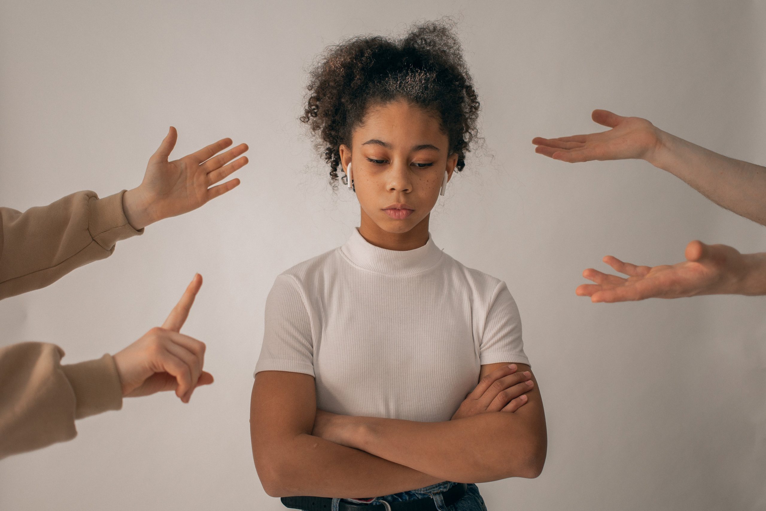 A woman thinking about how to tell her parents she is pregnant.